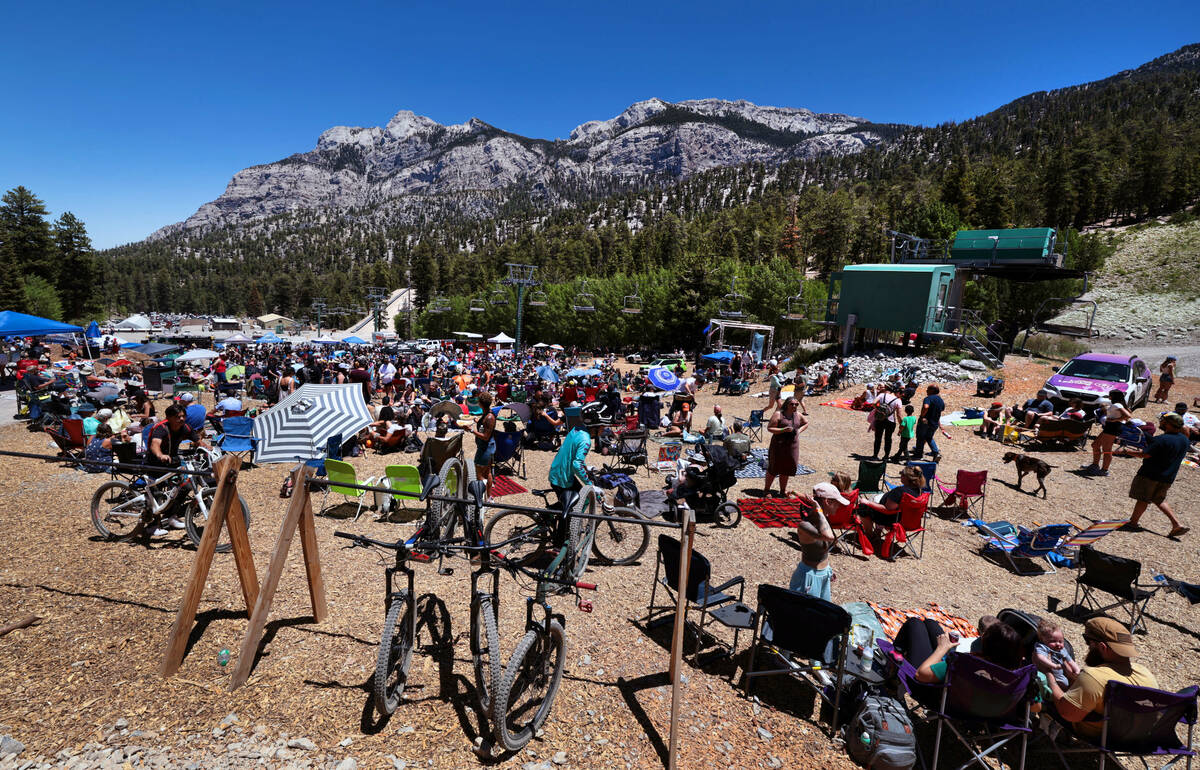 People gather about the Mountain Fest stage on Rabbit Peak to listen to the Smokestacks play, e ...