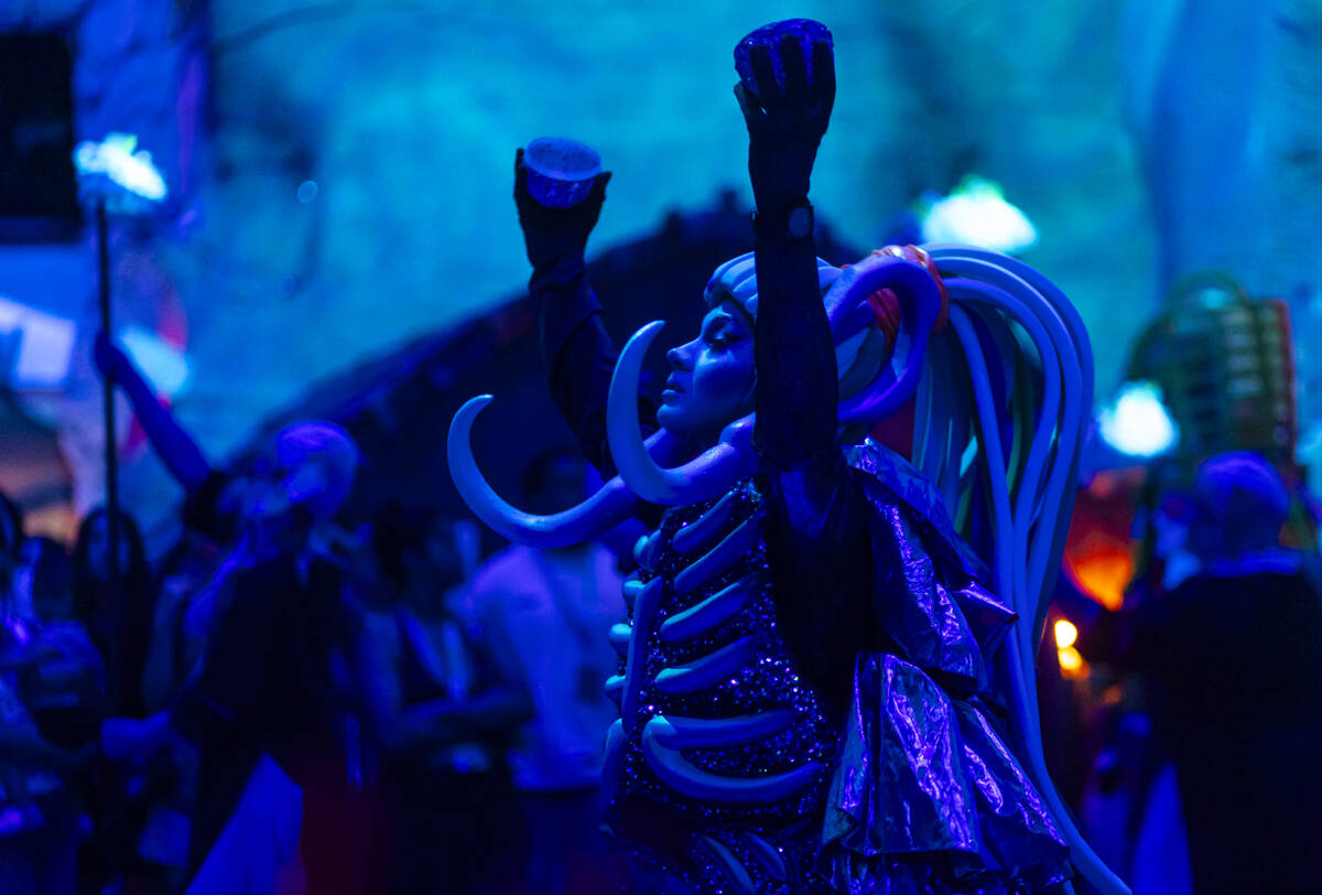 Cast members of "Phenomenomaly," an immersive experience within Omega Mart, perform a ...