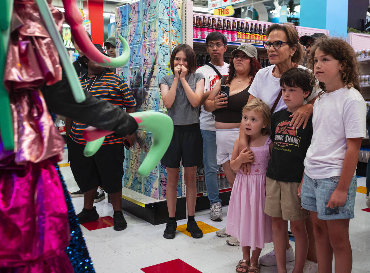 People with cast members of "Phenomenomaly," an immersive experience within Omega Mar ...