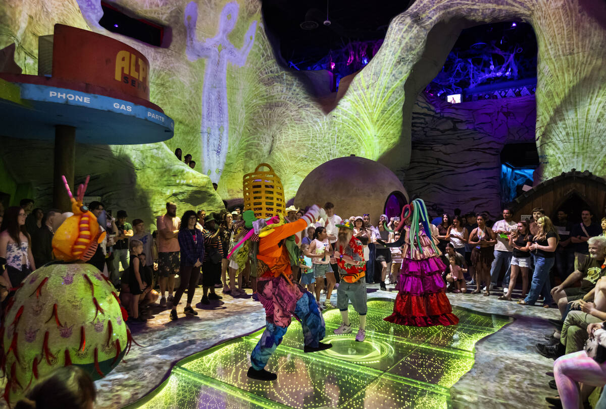 Cast members of "Phenomenomaly," an immersive experience within Omega Mart, perform a ...