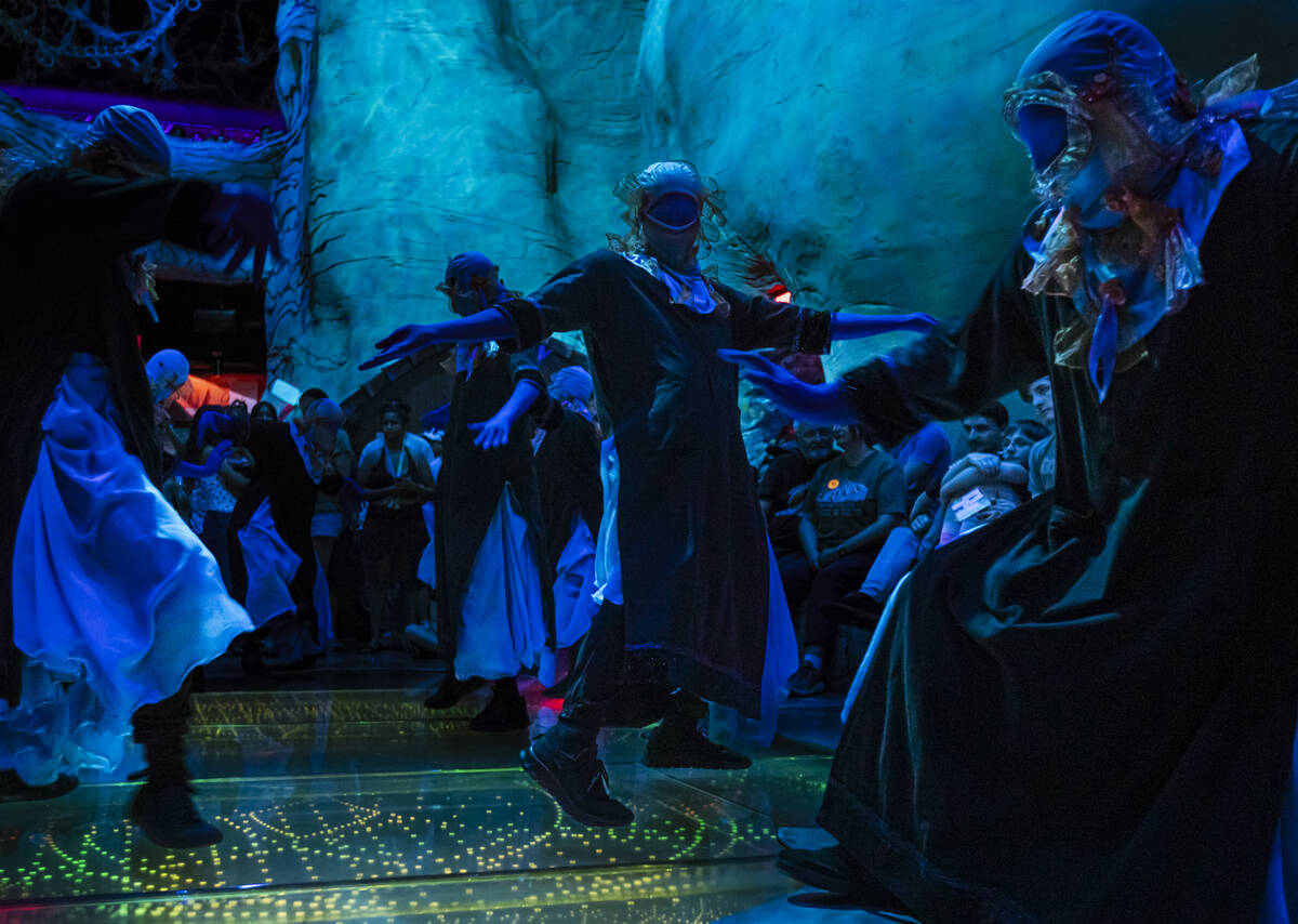 Cast members of "Phenomenomaly," an immersive experience within Omega Mart, perform a ...