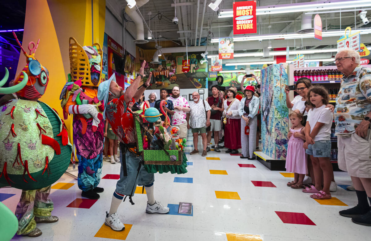 Cast members of "Phenomenomaly," an immersive experience within Omega Mart, perform a ...