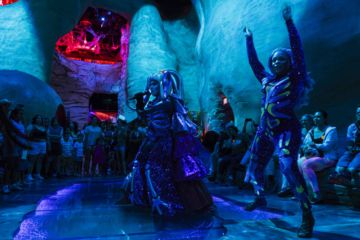 Members of Cosmetix perform in "Phenomenomaly," an immersive experience within Omega ...