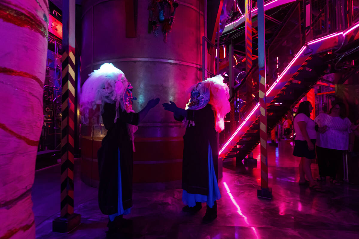 Cast members of "Phenomenomaly," an immersive experience within Omega Mart, perform a ...