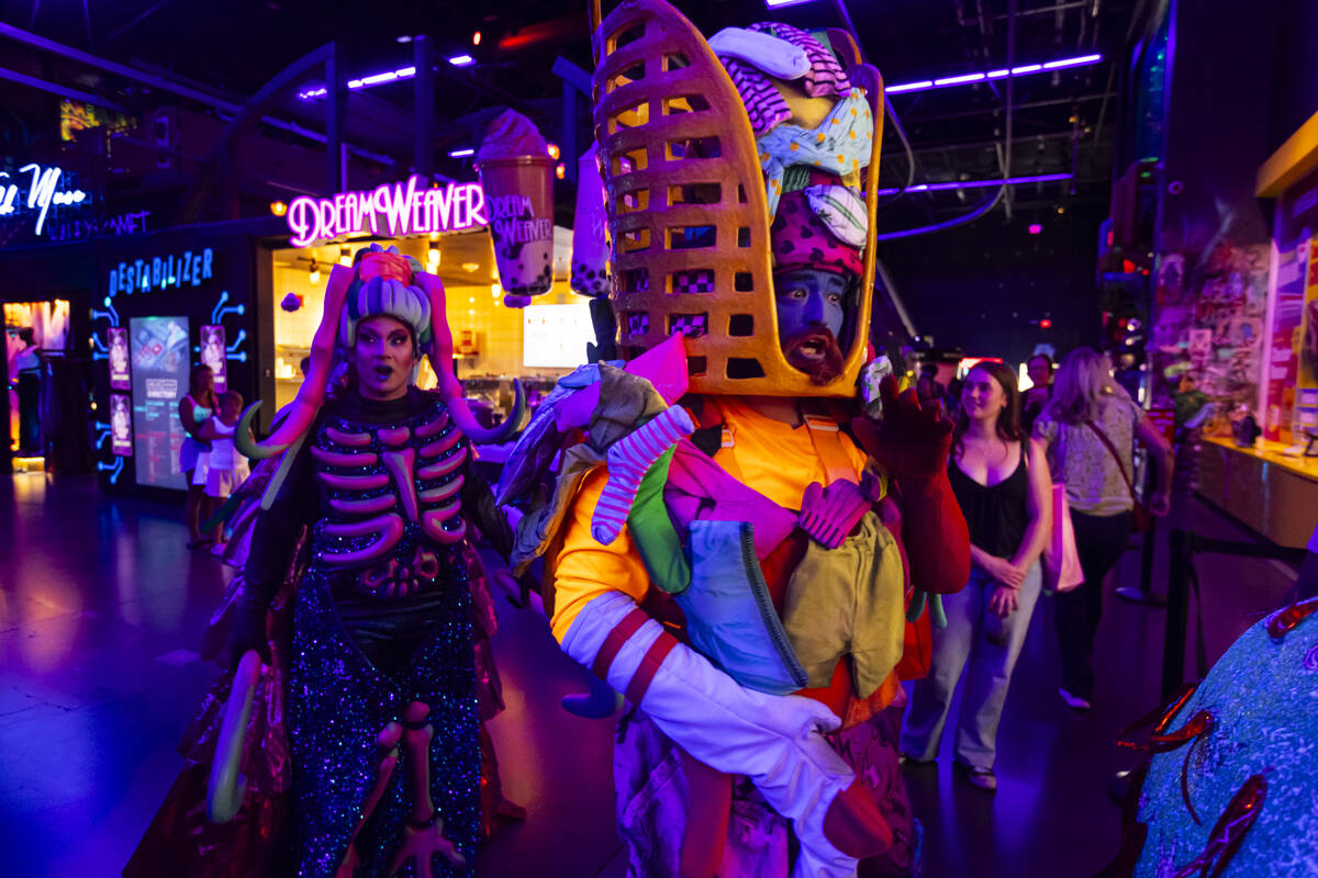Cast members of "Phenomenomaly," an immersive experience within Omega Mart, begin the ...