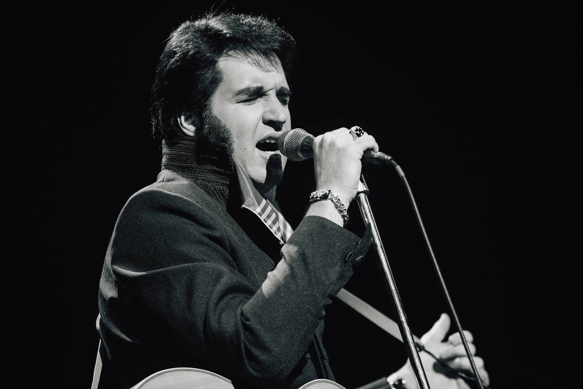Travis Powell, an Elvis tribute artist, performs during “1969 Live Concert: The King Ret ...