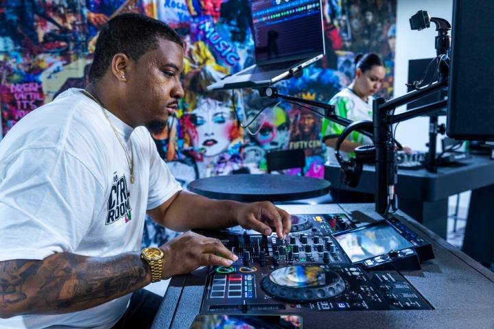 Chris Clark works the board at CTRL Room which offers a 90-minute DJ experience with instructio ...