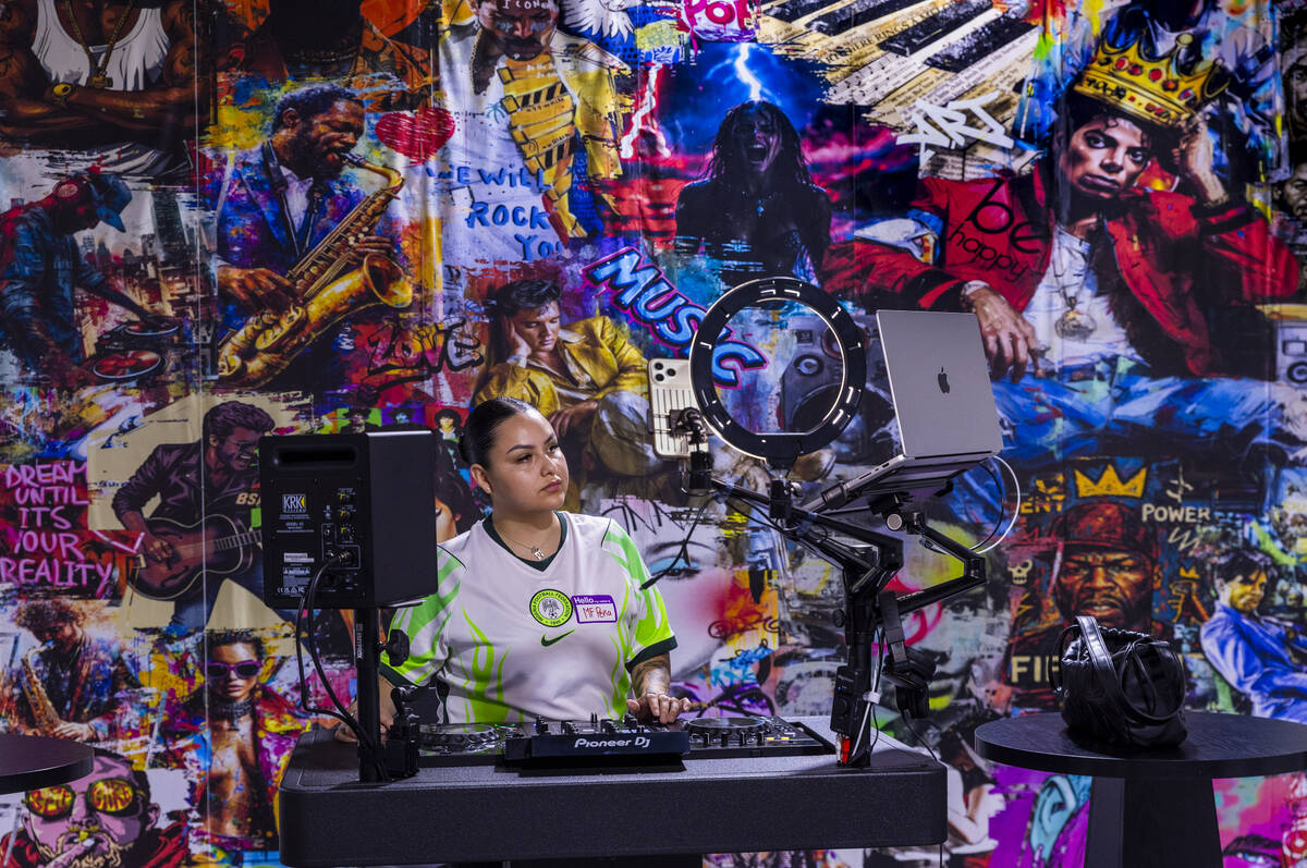 Student MF Pena practices what she's learned in class as CTRL Room offers a 90-minute DJ e ...