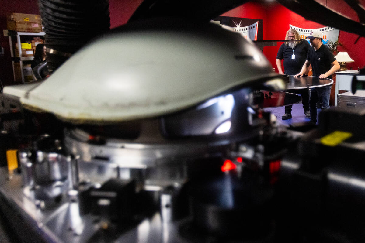 Shane Kaiser, right, a region technician at Brenden theaters, and Ted Cotton, an IMAX projectio ...
