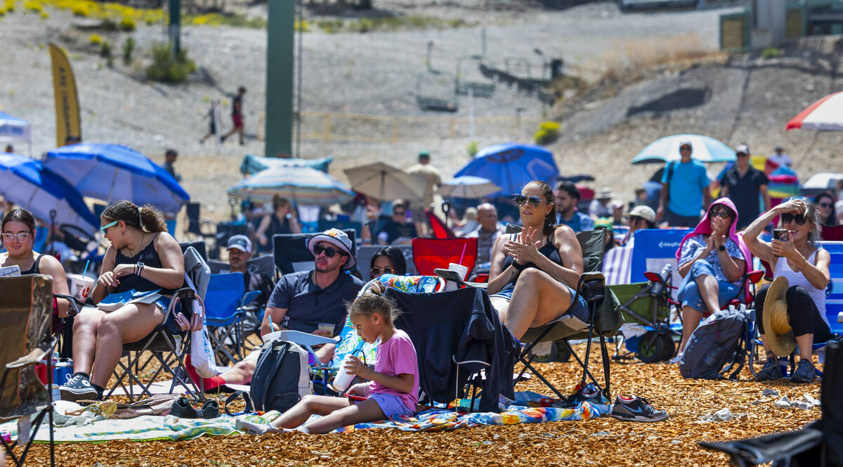 People sit and enjoy the music of the Parametrics during the Music on the Mountain outdoor conc ...