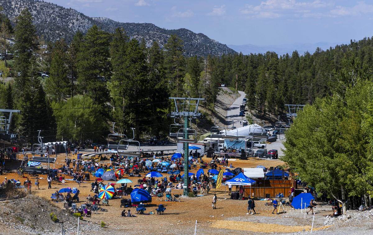 People sit and relax before the stage during the Music on the Mountain outdoor concert series a ...