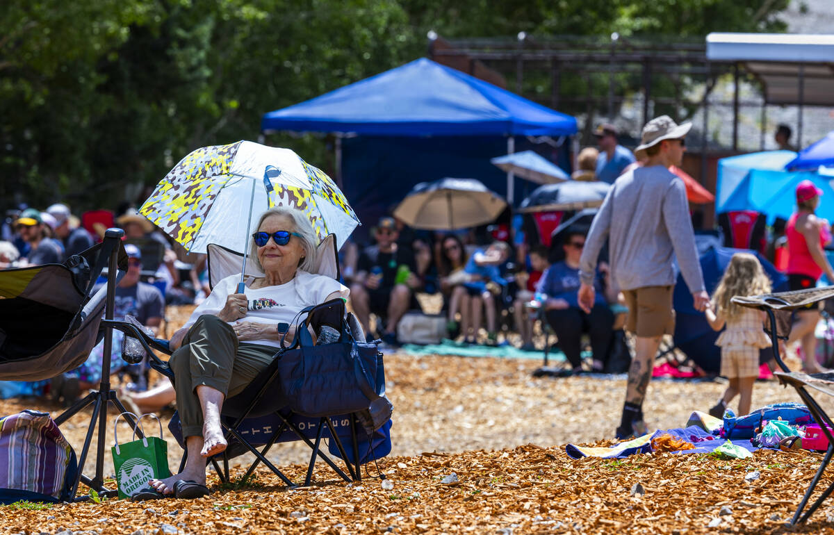 People sit and enjoy the music of the Parametrics during the Music on the Mountain outdoor conc ...