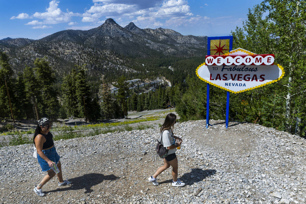 Hikers walk from the top of the Bristlecone Skyway scenic chairlift for a view of the Spring Mo ...