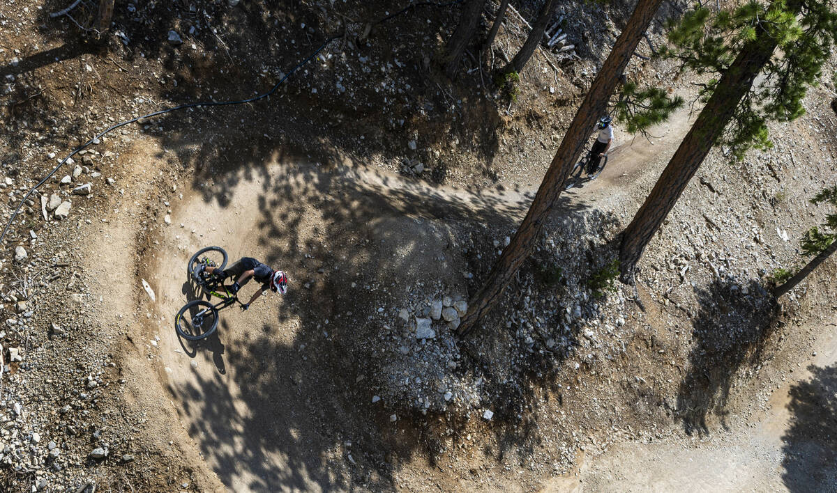 A mountain biker winds down a scenic trail as the Music on the Mountain outdoor concert series ...