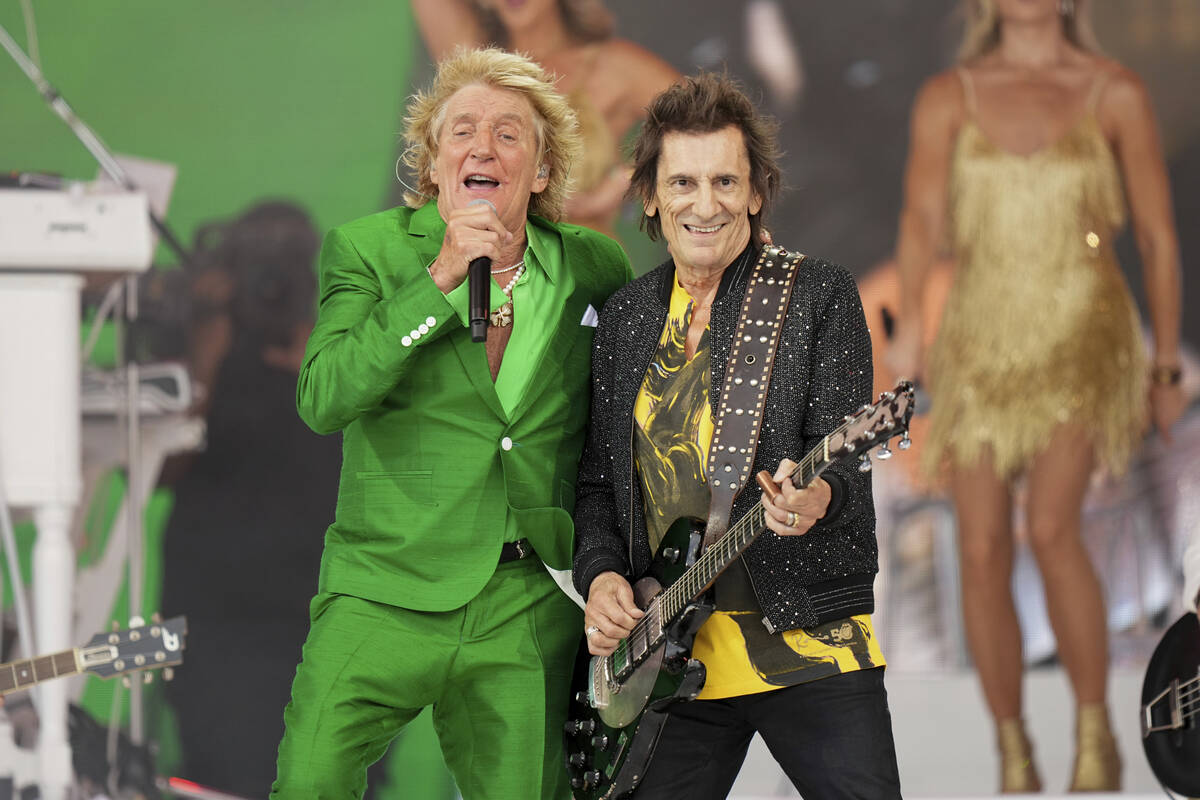 Rod Stewart, left, is joined on stage by Ronnie Wood during the Glastonbury Festival in Worthy ...