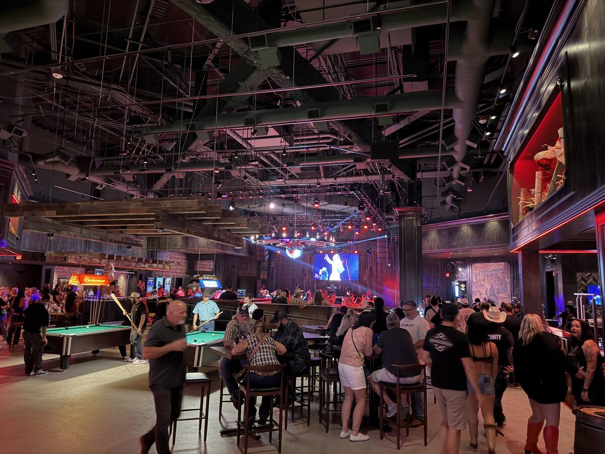 Assorted revelers are shown at the preview opening of Stoney's Sunset at Sunset Station on Frid ...