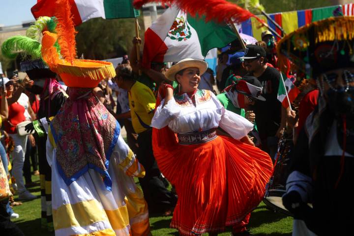 Attendees dance during the fifth annual kickoff celebration for Hispanic Heritage Month on Sund ...