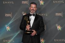 Jimmy Kimmel poses with the award for outstanding host for a game show for "Who Wants to B ...