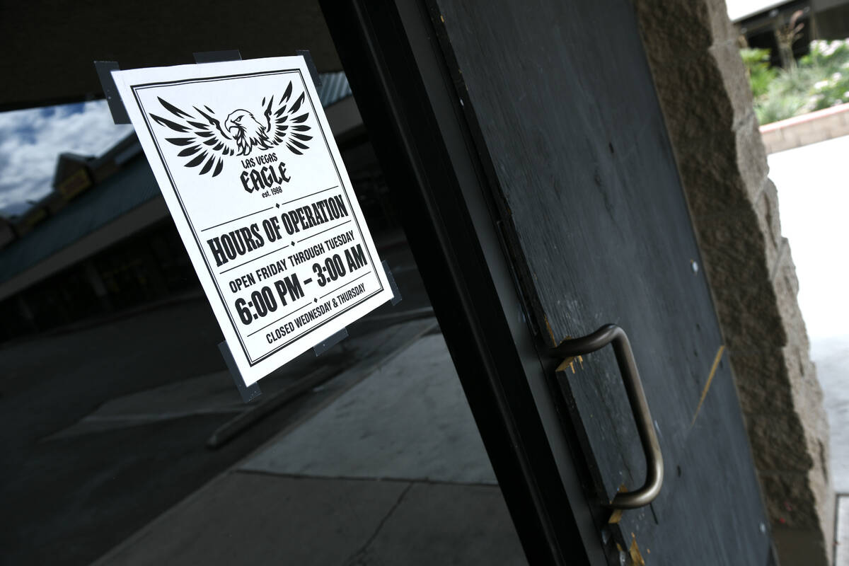 Hours of operation sign on the front door of the Las Vegas Eagle showing Friday through Tuesday, 6 p.m. to 3 a.m.