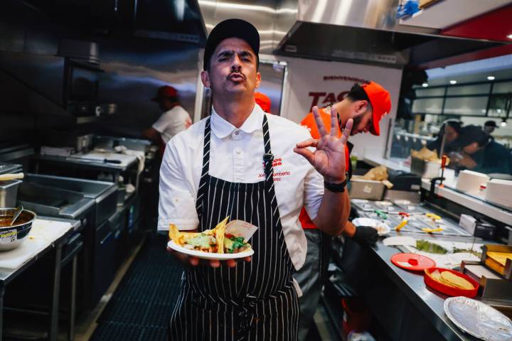 Chef Jorge Alvarez-Tostado holds up tacos at Tacos 1986 at The Neighborhood Food Hall in the Re ...