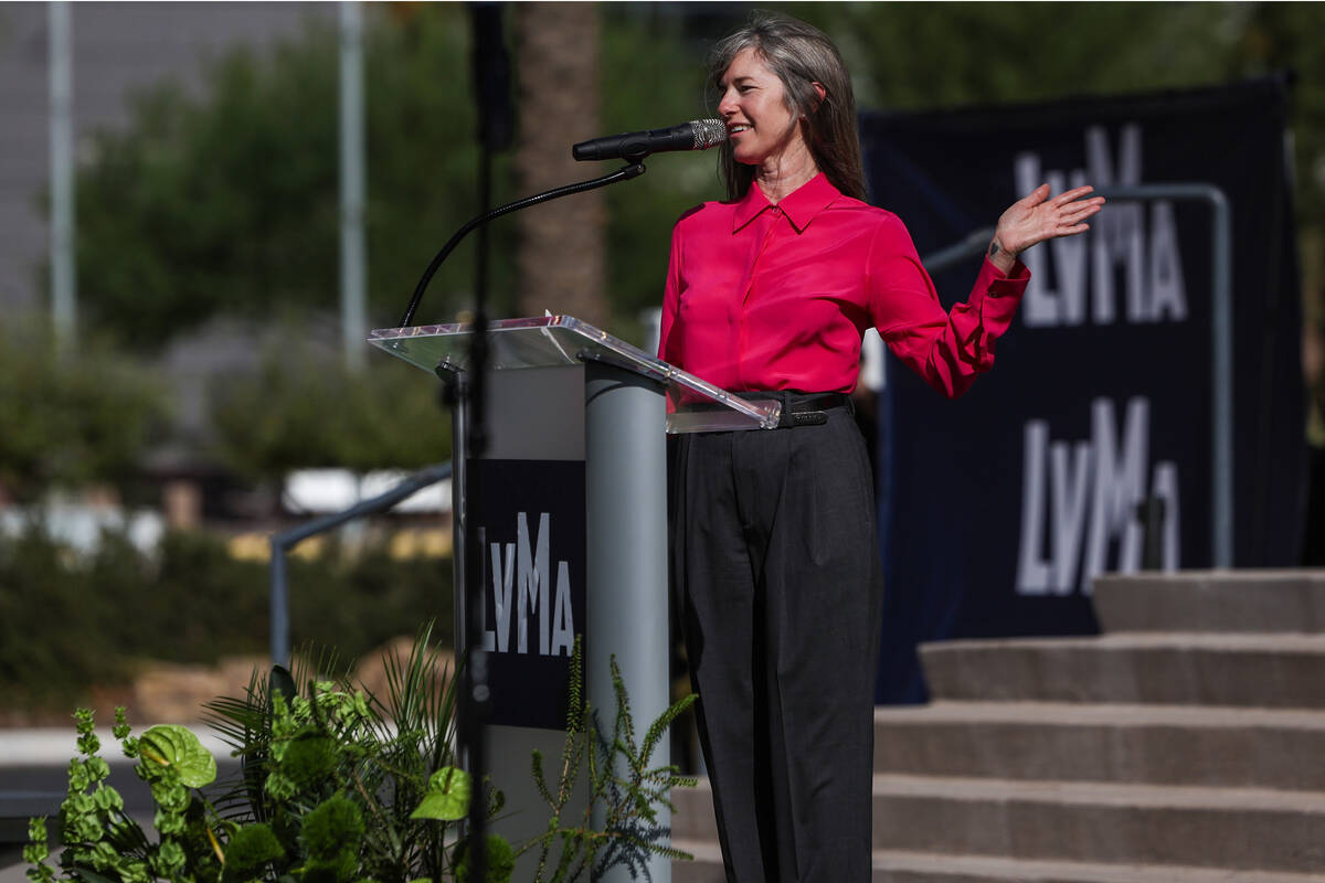 A speaker addresses the crowd from a podium with Las Vegas Museum of Art LVMA banners during the Grand Central Galleries groundbreaking in Symphony Park
