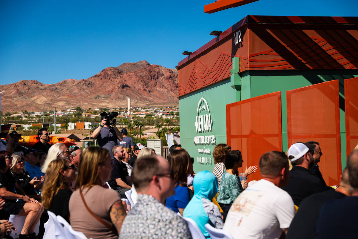 A crowd sits outside and listens to speakers of the opening ceremony of the Travel Nevada Adven ...