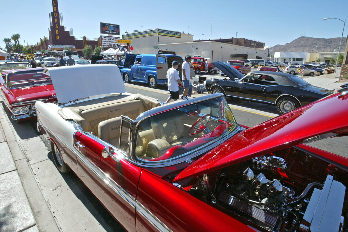 Car enthusiasts check out the classic cars along Water Street in downtown Henderson during the ...