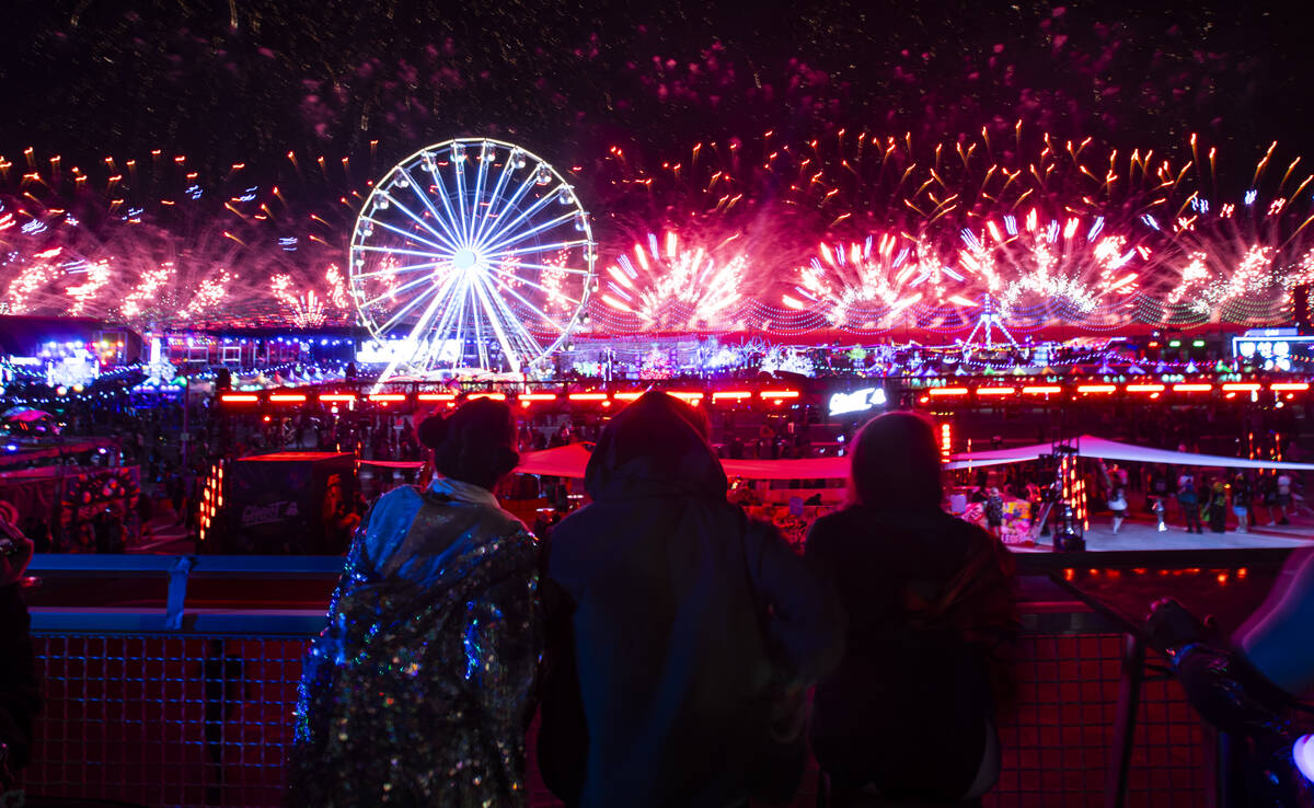 Attendees watch as fireworks go off during the final night of the Electric Daisy Carnival at La ...