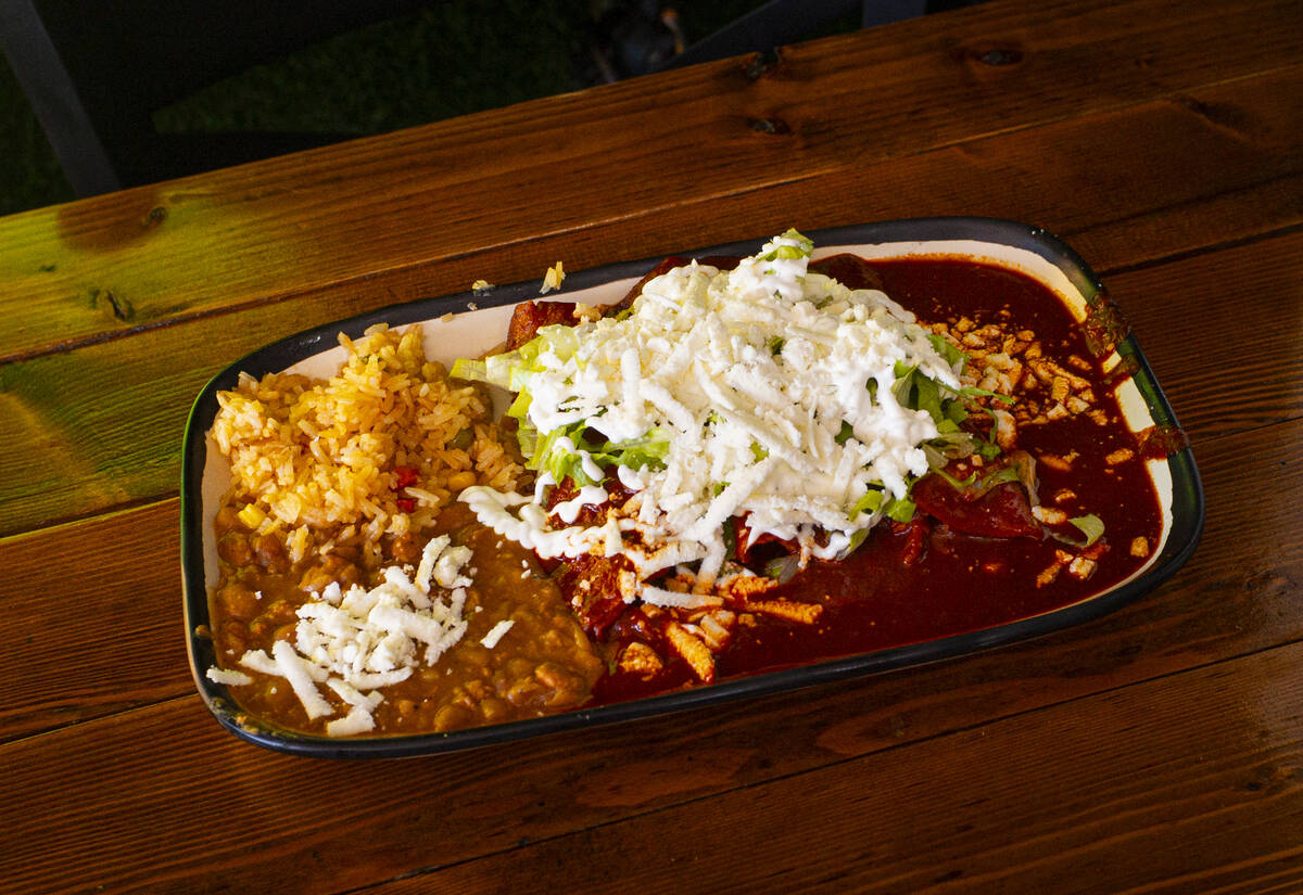 Enchiladas guajillo are seen at Barbacoa Hidalguense at the Broadacres Marketplace on Sunday, S ...