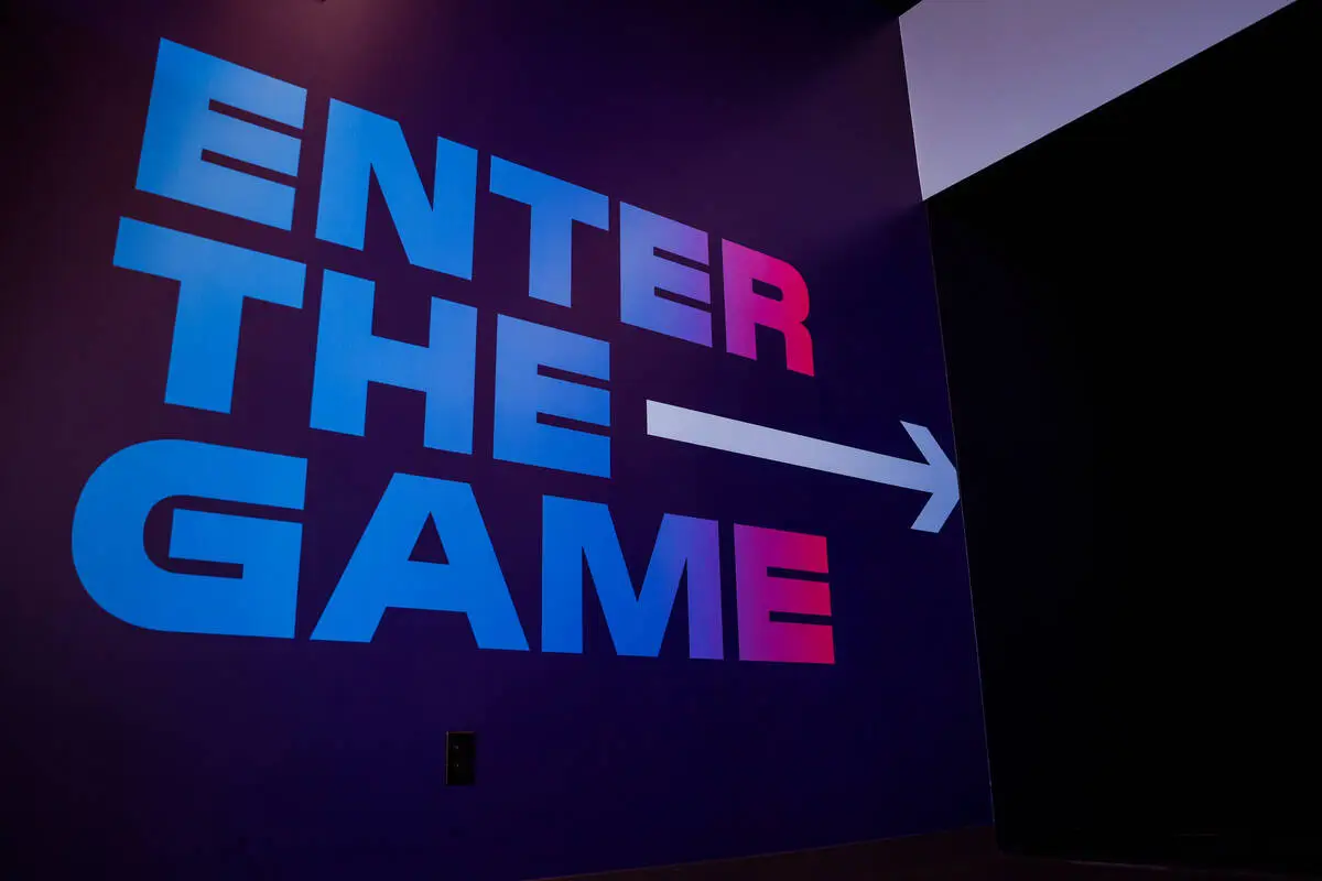 “Enter The Game” sign directing players to the gaming area of Activate Games at T ...