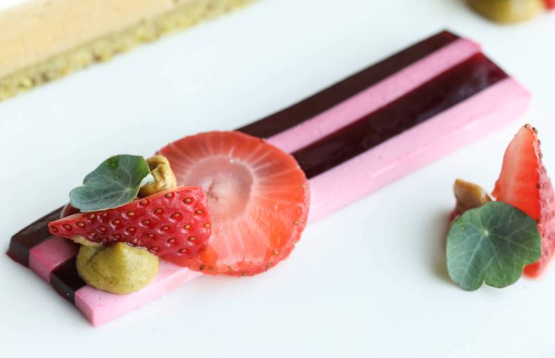 A slender foie gras terrine with strawberry and pistachio cream, plated at Bar Boheme in the downtown Las Vegas Arts District (Benjamin Hager/Las Vegas Review-Journal)