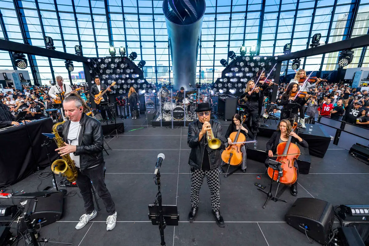 David Perrico and the Raiders House Band perform on stage before the team faces the Miami Dolph ...