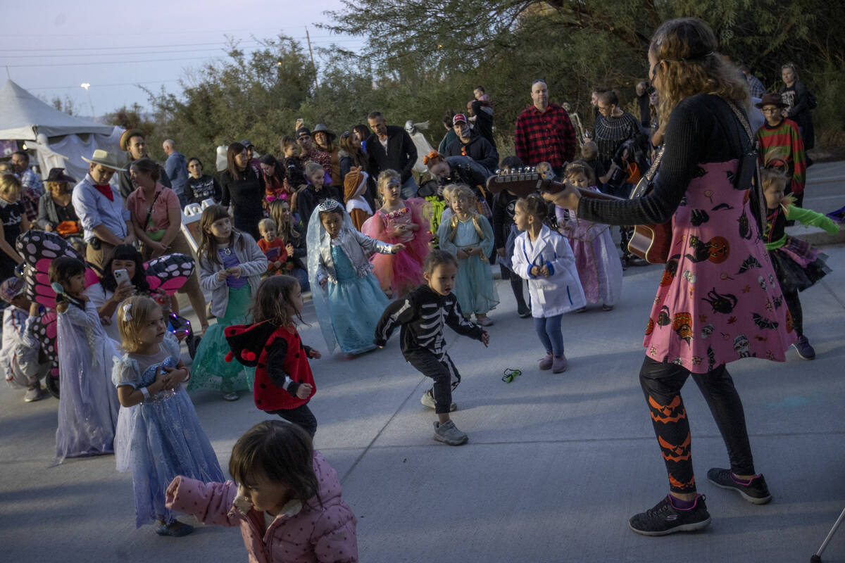 Costumed little ones dance after spooky story time during the Haunted Harvest Halloween event a ...