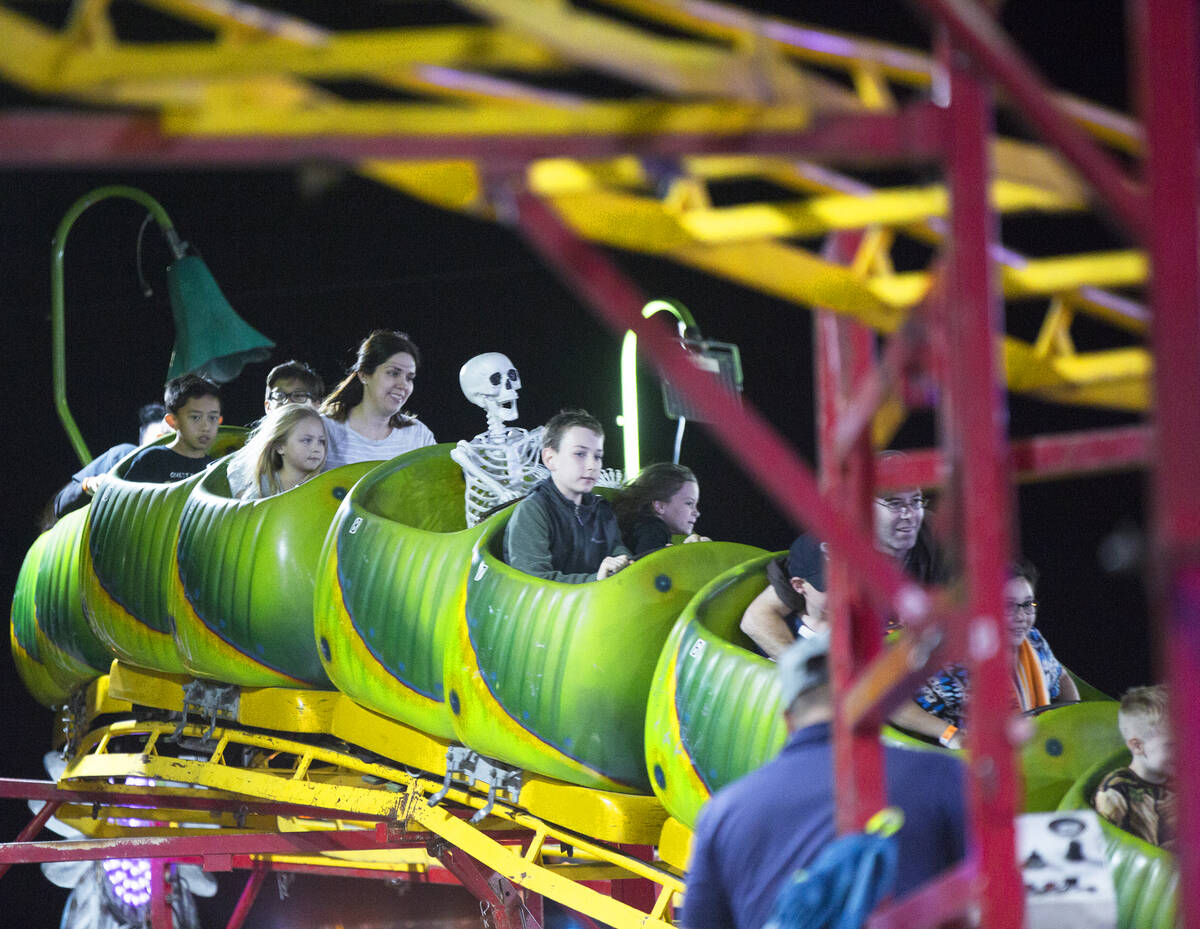 Attendees enjoy the Wacky Worm Coaster at HallOVeen. (Benjamin Hager Las Vegas Review-Journal)