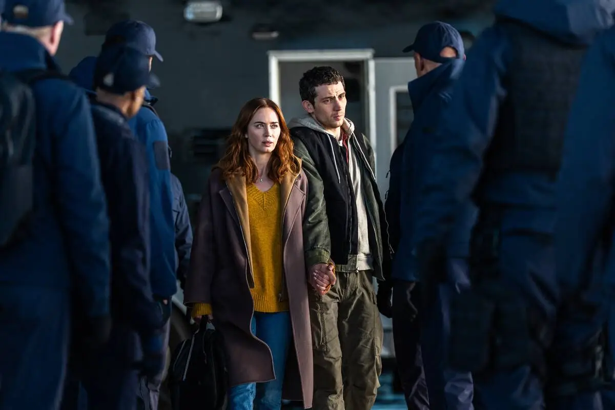 This image released by Universal Pictures shows Emily Blunt, left, and Josh O'Connor in a ...